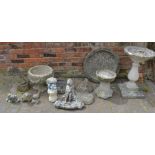 Collection of garden ornaments including bird bath