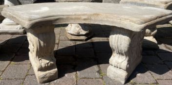 Curved concrete garden seat on classic plinths