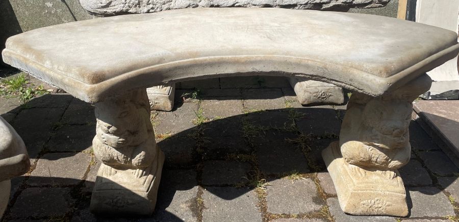 Curved concrete garden seat on squirrel plinths