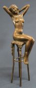 Contemporary bronze figure of female nude seated on a stool with indistinct signature 26cm high