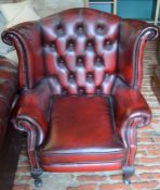 Leather wing back armchair in oxblood red leather made by Winchester Furniture