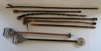 Pair of Featherwate shooting sticks and assortment of walking sticks including horn handled, thumb