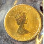 1985 Canadian 10 dollar quarter ounce gold coin in a plastic pouch