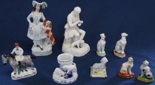 Staffordshire figurine of lady with spaniel, bisque figurine of Darwin, 19th century and later