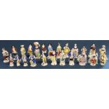 Selection of miniature porcelain figures many marked with a gold anchor