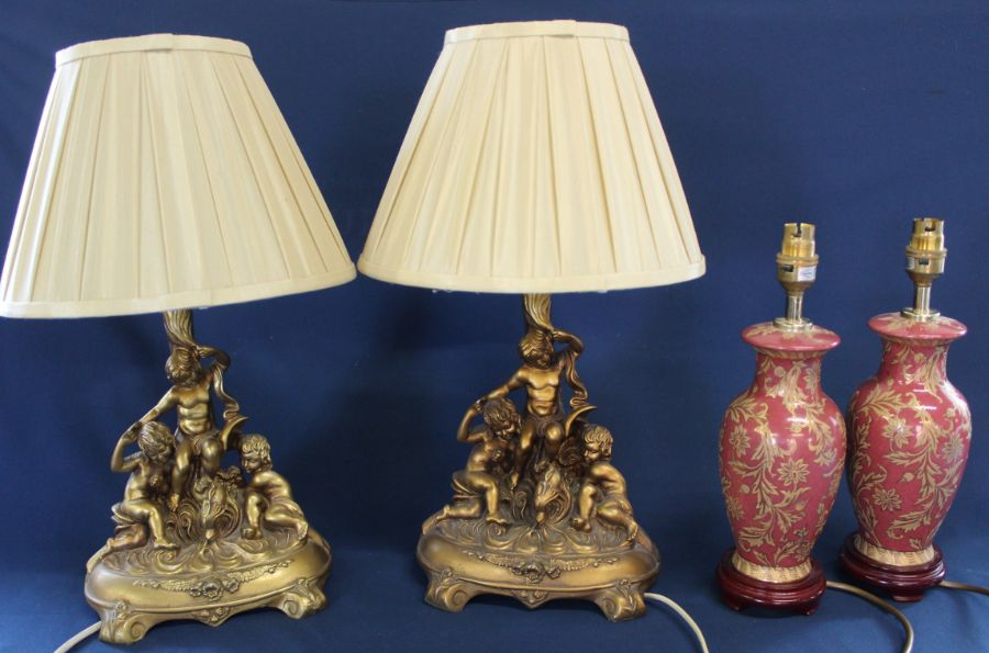 Pair of classical style gilt resin table lamps & pair of ornate porcelain table lamps