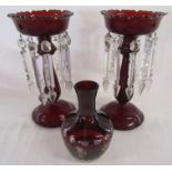 Pair of ruby glass lustres - one showing slight damage - and cased glass vase