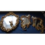 3 modern decorative gilt framed mirrors with cherub decoration (1 cherub loose)