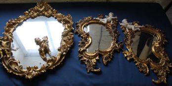 3 modern decorative gilt framed mirrors with cherub decoration (1 cherub loose)
