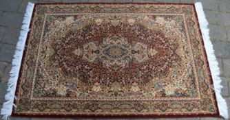 Fine woven full pile Turkish rug with all over floral medallion design 147cm by 100cm