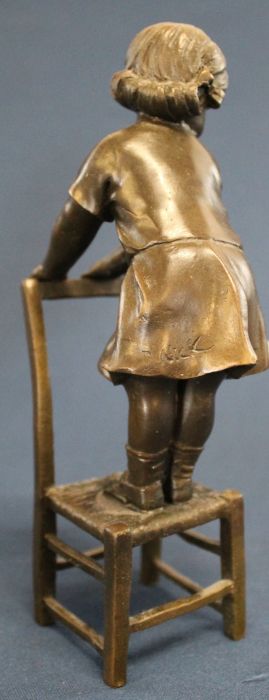 Contemporary bronze figure of a child standing on a chair signed "Nick" 20cm high - Image 2 of 2