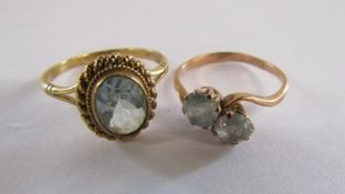 2x 9ct gold rings both with possibly aquamarine stone - single stone ring size O - double stone ring