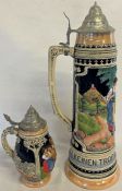 2 lidded beer steins, including one larger marked 'Keinen Tropfen Im Becher Mehr', holding up to