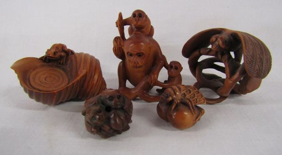 5 Wooden netsuke, signed - frog on a shell, monkey, dragonfly, bug on nuts, and a small round