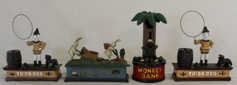 4 reproduction cast iron money boxes: 2 x Trick Dog, 1 x Bunnies Bank, 1 x Monkey Bank