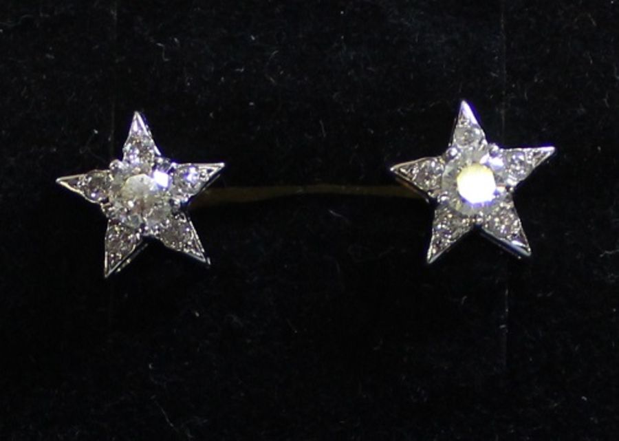 Tested as 9ct gold pair of diamond set star earrings, the butterflies marked 18k, total approx. 0.