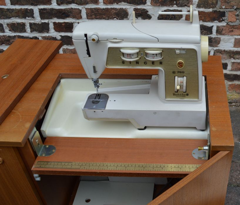 Sewing machine cabinet with Singer sewing machine and carry case - Image 2 of 2