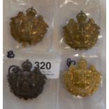 Four Lincolnshire Yeomanry cap badges (one dark metal & 3 bronze)