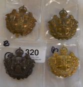 Four Lincolnshire Yeomanry cap badges (one dark metal & 3 bronze)