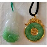 Tested as 18ct gold & jade disc pendant approx. 7.13g  approx. 2.6cm dia & a Kwan Yin jade pendant