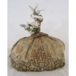 Lady wearing a crinoline dress tea cosy - ceramic figure of lady feeding birds - approx. 15cm