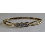 Diamond set bangle / bracelet marked 18k / 0.750, 11.79g