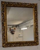 Ornate gilt frame wall mirror 63cm by 54cm