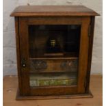 Victorian oak smokers cabinet (later used as stationery cabinet) with glass ink well & leather cigar