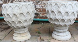 Pair of concrete deep pineapple patterned planters on circular bases