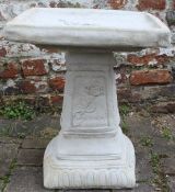 Clasico square bird bath adorned with a rose