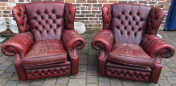 Pair of red leather chesterfield armchairs