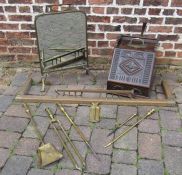 Brass fender with tool plate, fire irons, bevelled and cut mirrored fire screen and wooden coal