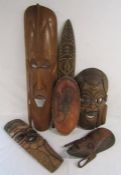 4 African tribal masks, one marked Jambo Kenya 1990 and 2 African tribal shields one labelled