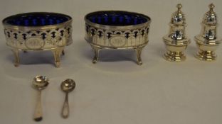 Pair of engraved Georgian silver table salts London 1792 with blue glass liners, silver salt and