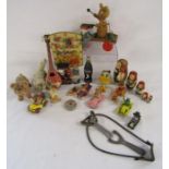 Collection of vintage toys includes Noddy wall clock, bone dice shaker with dice, Peter Pocket
