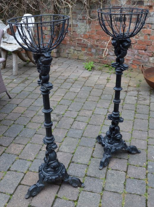 Pair of large cast iron plant stands (formerly the base of high level pub tables)
