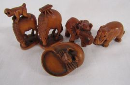5 Wooden netsuke, signed - monkey on a horse, bug on a horse, frog on an elephant, elephant and crab