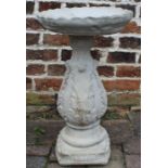 Vineyard bird bath adorned with vine leaves