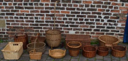 Large quantity of wicker basket ware, including shopper, dog bed, picnic hamper, etc