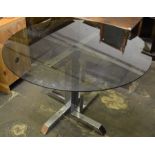 Smoked glass top table on a chrome plated base Dia 117cm