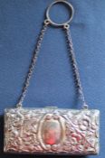 Silver purse with embossed floral decoration on silver chain with fitted leather interior Birmingham
