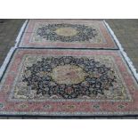 Pair of blue & pink ground Iranian Tabriz hand knotted carpets 204cm by 146cm