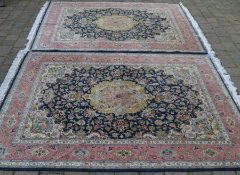 Pair of blue & pink ground Iranian Tabriz hand knotted carpets 204cm by 146cm