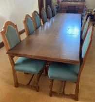 An extremely large bespoke refectory table (396cm by 106cm Ht 76cm) with matching set of 12