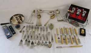Collection of silverplate cutlery, candle holder with snuffer, pourers, also a Camel cigarettes