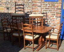 Ercol dining table 183cm by 88cm and 8 Ercol dining chairs, including 2 carvers