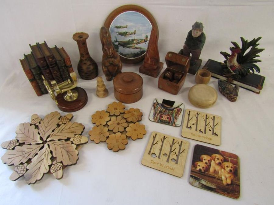 Collection of mostly wooden items includes ships wheel nutcracker, place mats, glasses holder,