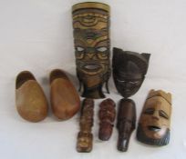 Pair of Dutch clogs and selection of African tribal masks