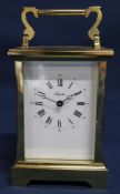 20th century brass cased Angelus carriage clock, 18cm tall with handle raised - with key (appears to