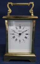 20th century brass cased Angelus carriage clock, 18cm tall with handle raised - with key (appears to